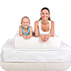 Woman and child lying on bed