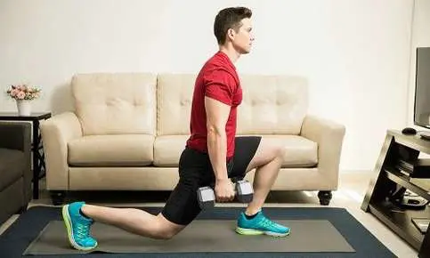 Lunging exercise on yoga mat indoors