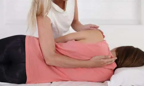 Chiropractic adjustment on woman lying down