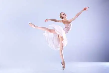 Ballet dancer performing elegant leap