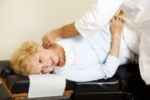 Chiropractic adjustment on an elderly woman