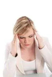 Woman with headache touching temples