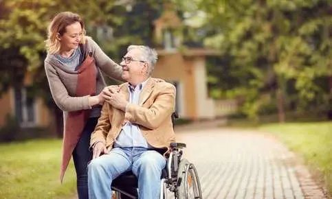 Caregiver and senior outdoors