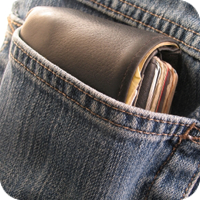 Wallet peeking from jean pocket