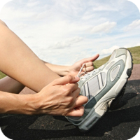 Runner lacing up sneakers
