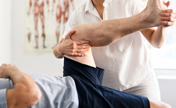Physiotherapy session with leg movement therapy