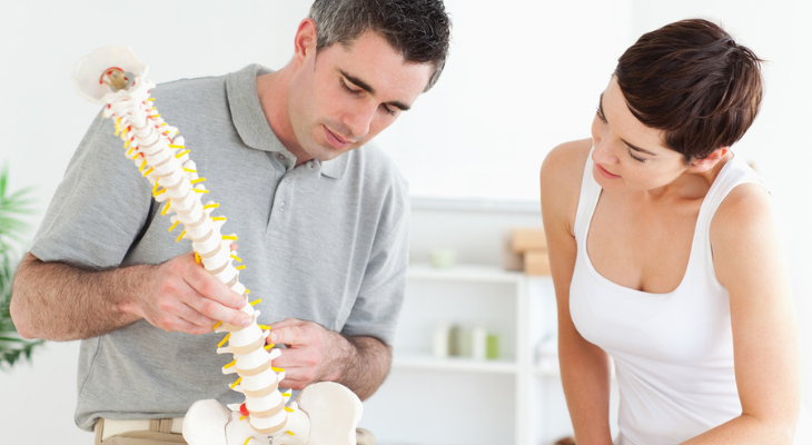 Medical consultation with spine model