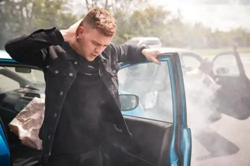 Man exits car after accident