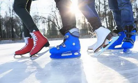 Ice skaters gliding in the sun