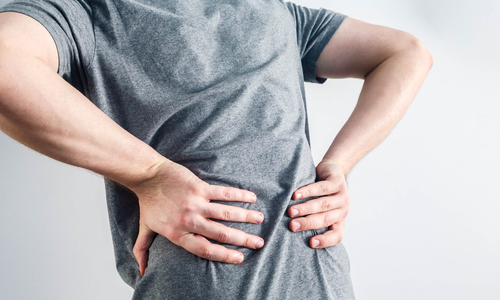 Man experiencing lower back discomfort