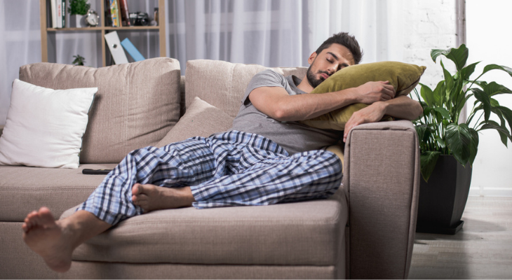 Relaxing on sofa in plaid pajamas