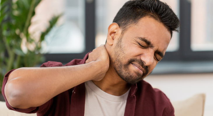 Man experiencing neck pain