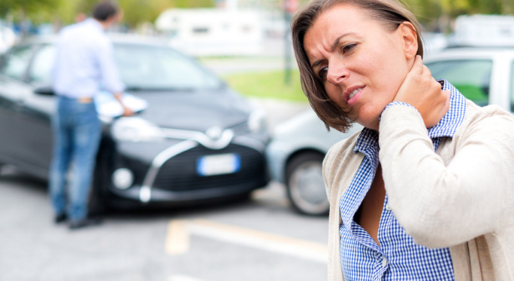 Car accident scene with injured woman