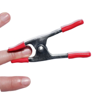 Hand gripping metal spring clamp