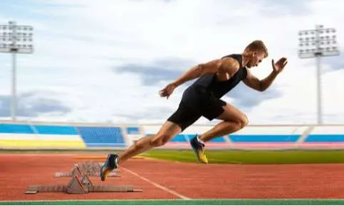 Runner in motion at stadium