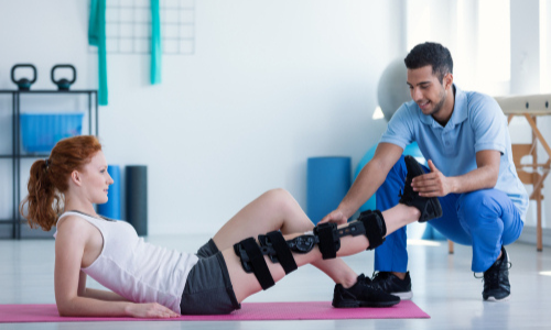 Rehabilitation workout on pink mat