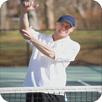 Man in white shirt playing tennis