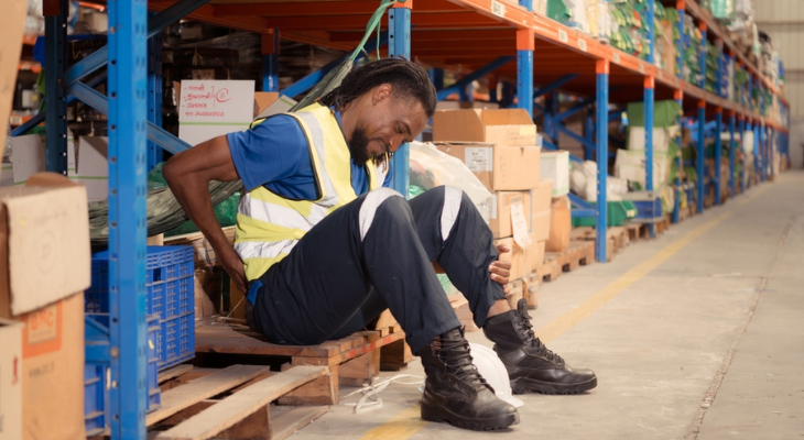 Worker in safety vest taking break