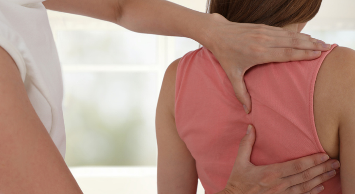 Woman receiving chiropractic treatment