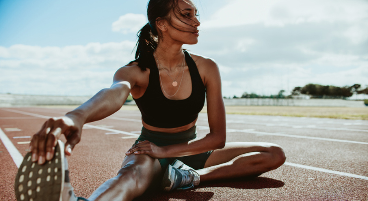 Woman performing leg stretch exercise