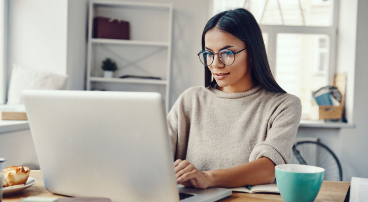 Focused woman using computer indoors