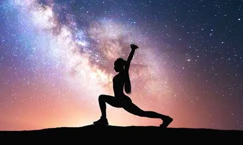 Yoga pose in front of night sky