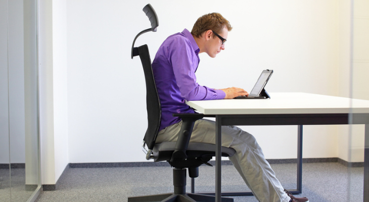 Poor posture while working on laptop