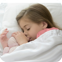 Sleeping child cuddling a toy