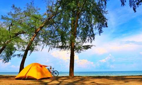 Bicycle beside seaside tent