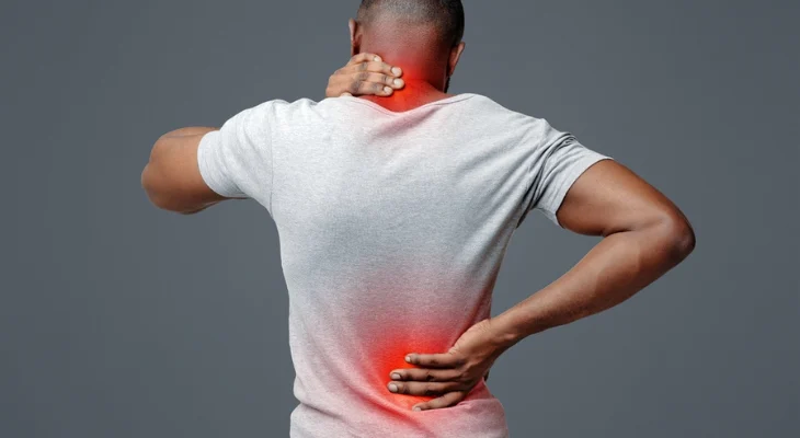 Man with back pain holding neck