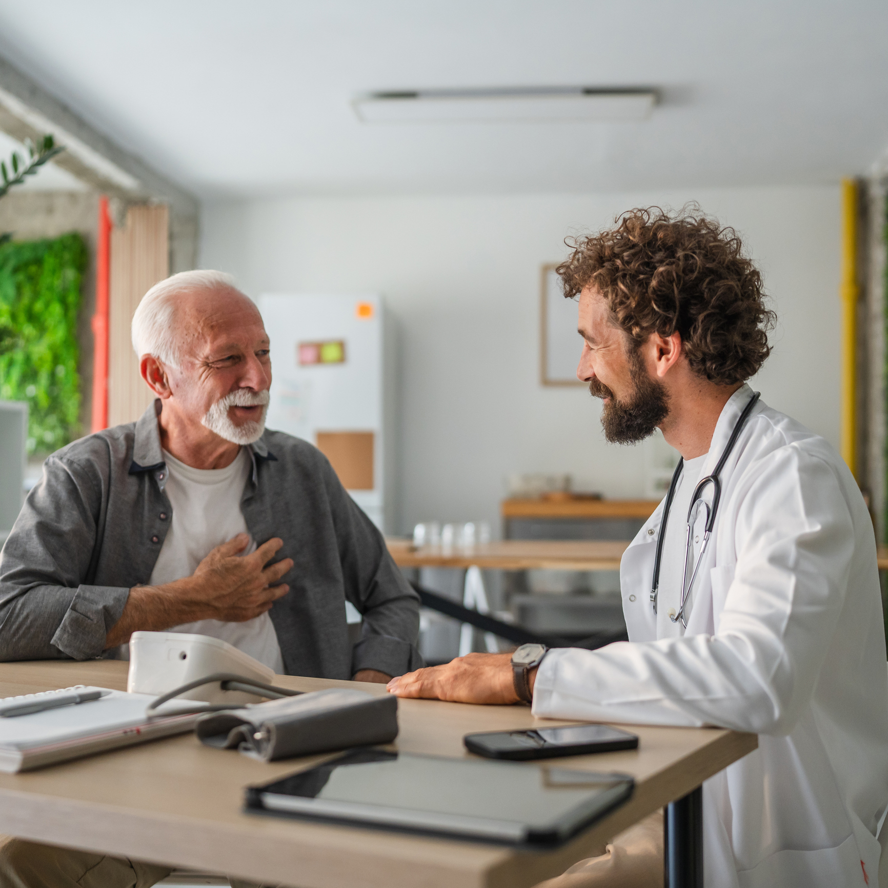 Medical appointment with doctor and older man