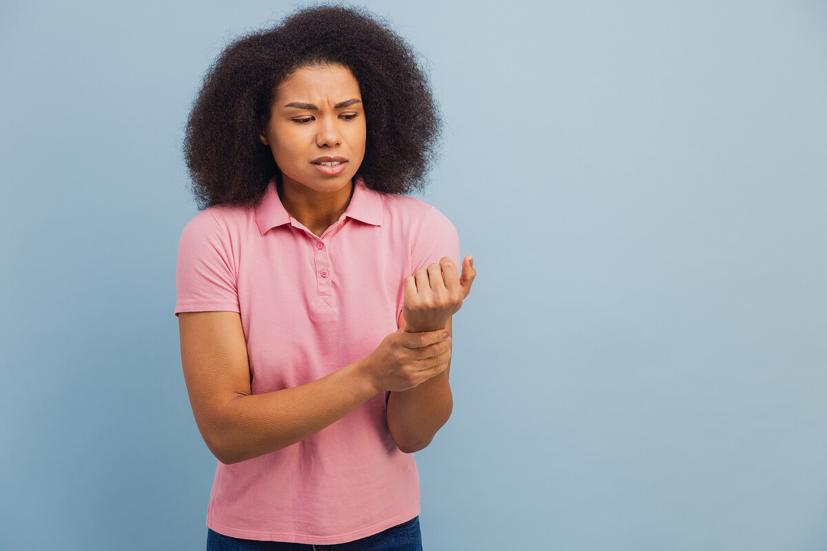 Individual with wrist pain expression