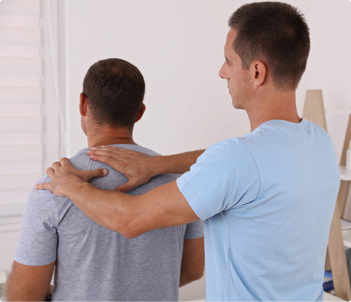Man receiving back massage therapy