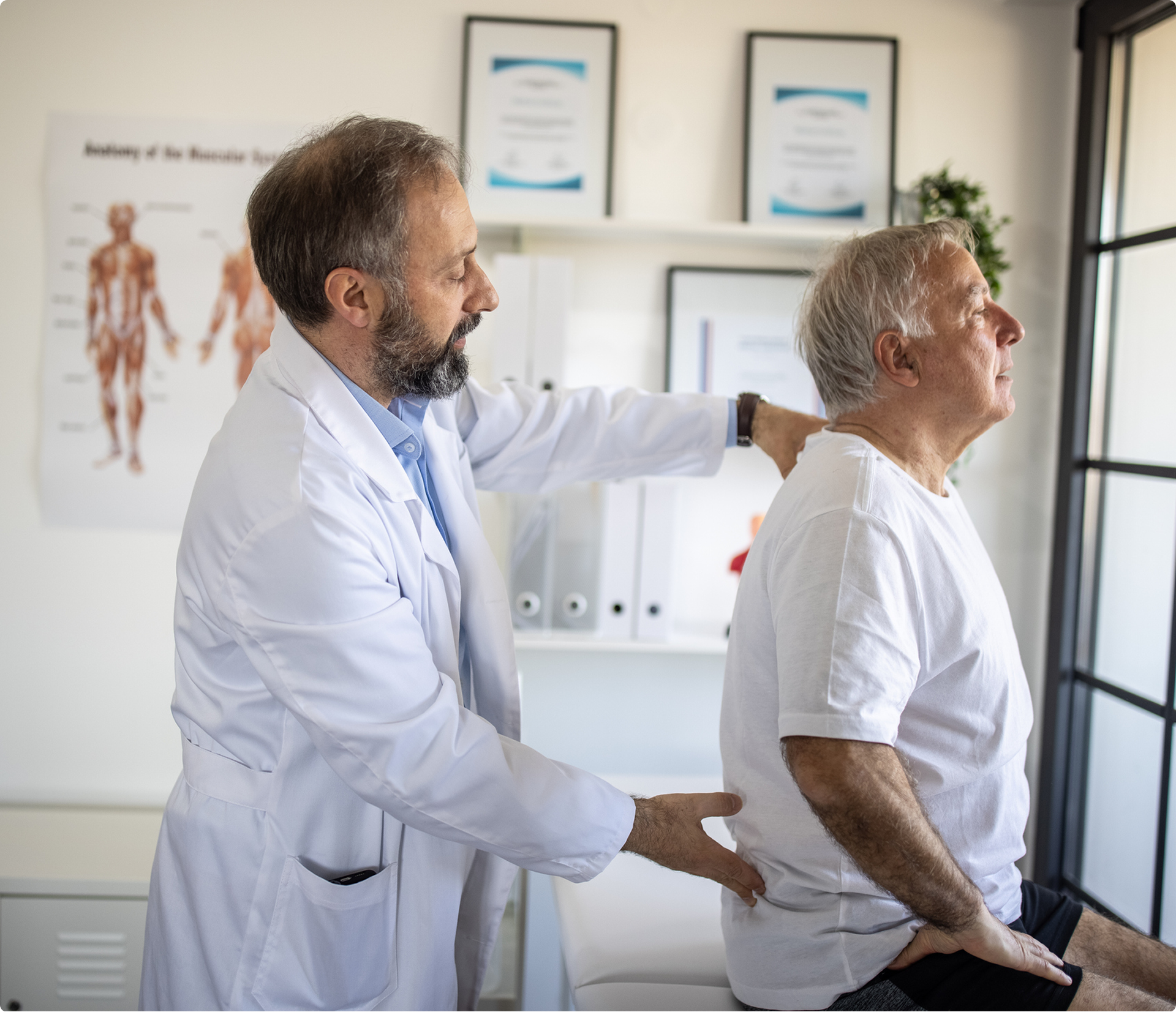 Healthcare professional assessing back pain