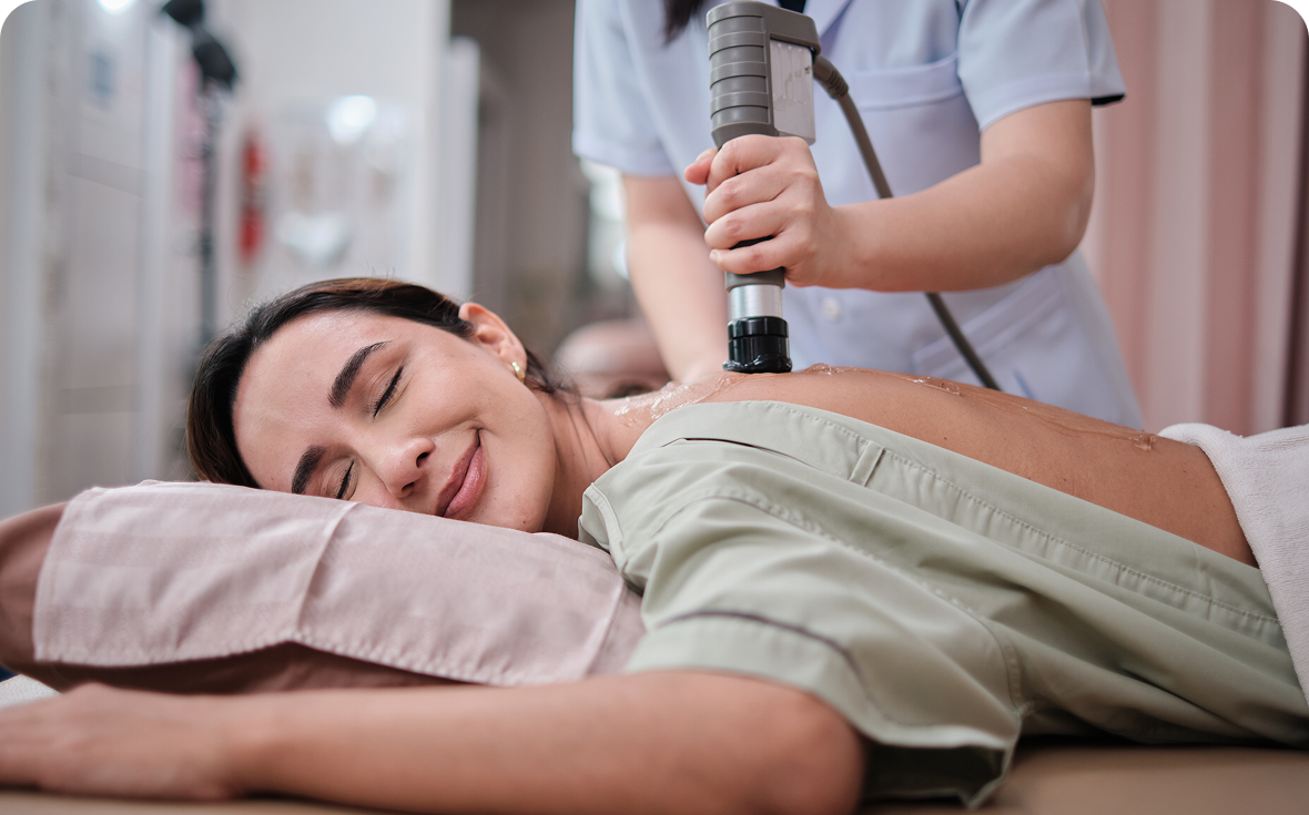 Smiling woman receiving back massage