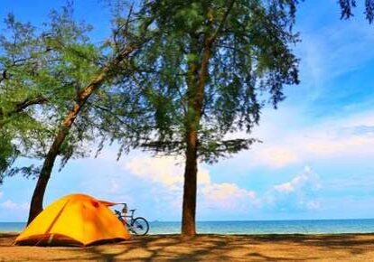 Bicycle beside seaside tent