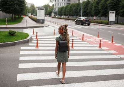 Person crossing a city street