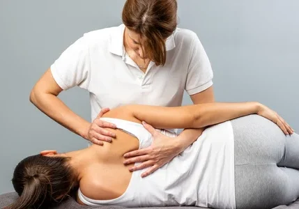 Woman receiving spinal alignment treatment