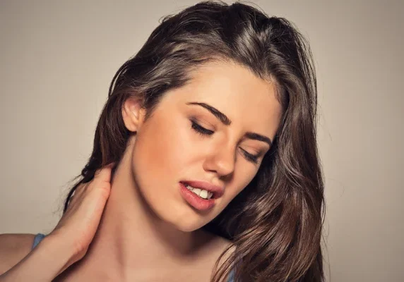 Woman experiencing neck pain