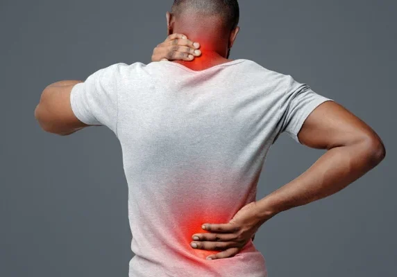 Man with back pain holding neck