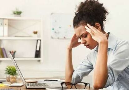 Tired woman in office setting