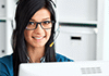 Smiling office worker with headphones