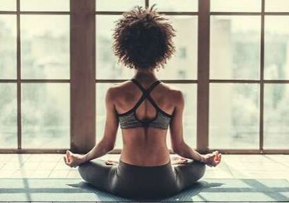 Meditative pose with natural light background
