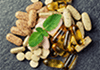 Vitamins and supplements on a dark surface
