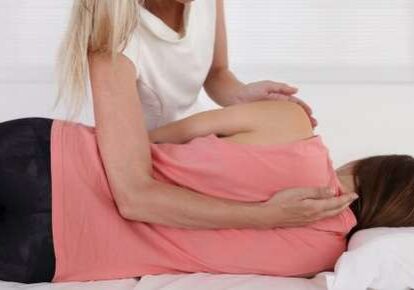 Chiropractic adjustment on woman lying down