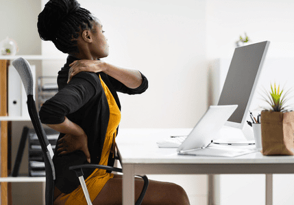 Woman stretching at desk
