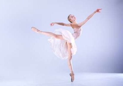 Ballet dancer performing elegant leap