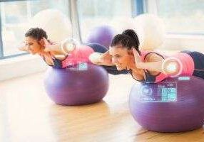 Workout session featuring virtual tech and exercise balls