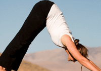 Downward dog yoga position outside