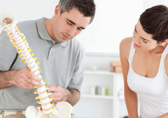 Medical consultation with spine model